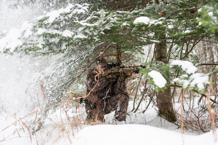 bow hunter in snow