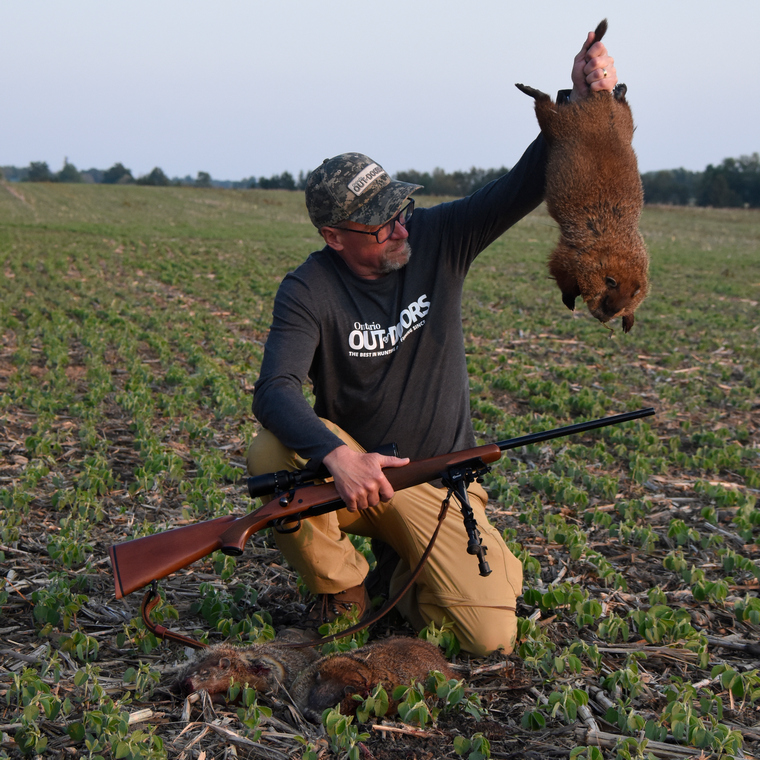 hunter with a successfully harvested groundhog