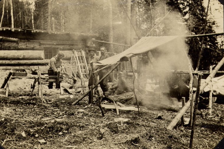 Smoking jerked moose meat at a camp