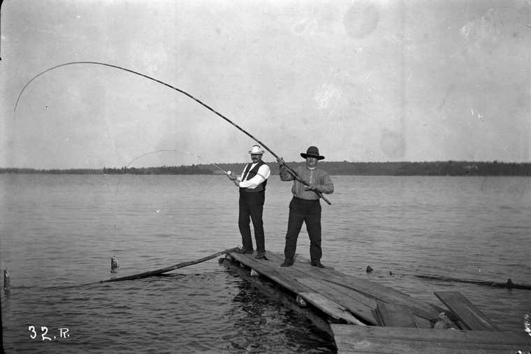 two anglers on a dock