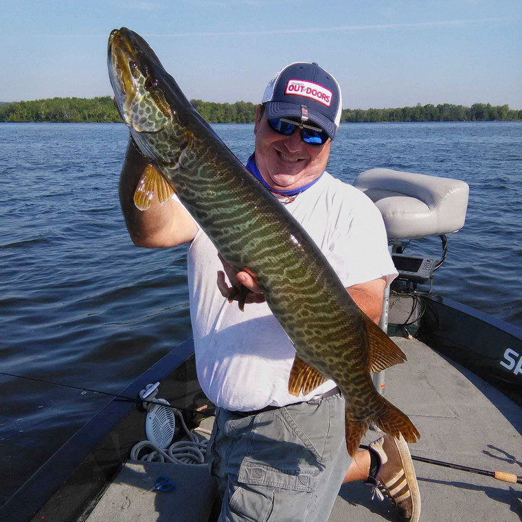 OOD’s Stephen Bates releases a tiger muskie