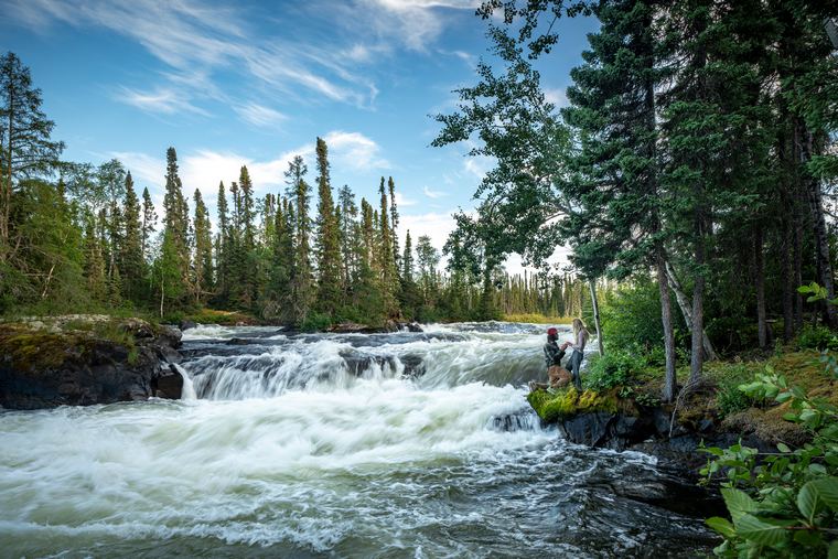 wild proposal beside a waterfall