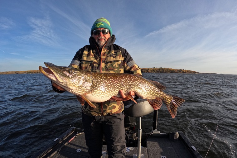 angler holding a pike