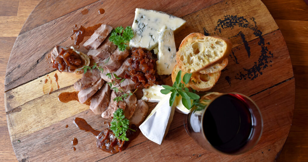 Corned goose breast with bacon and onion jam