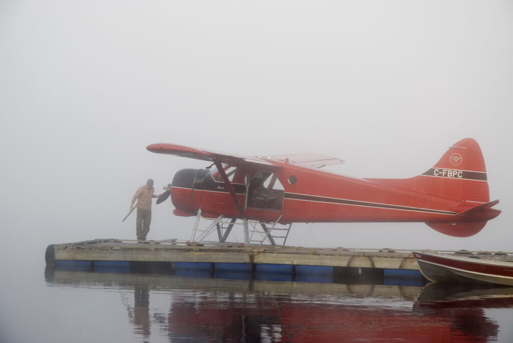float plane beside a dock