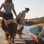Family on dock getting into boat