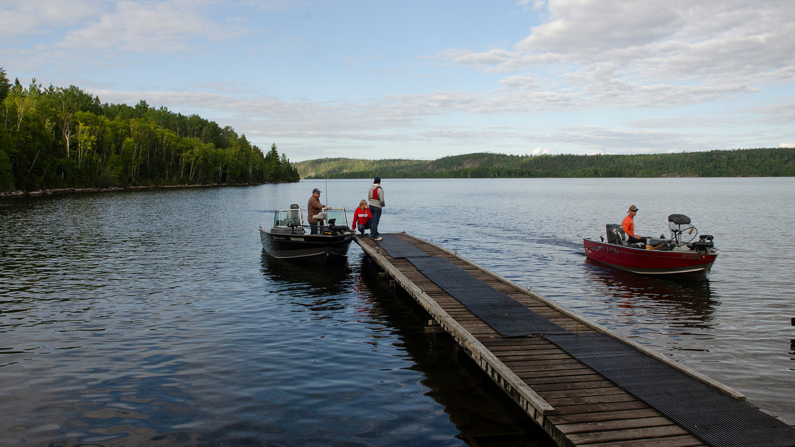 Boats at dock on lake